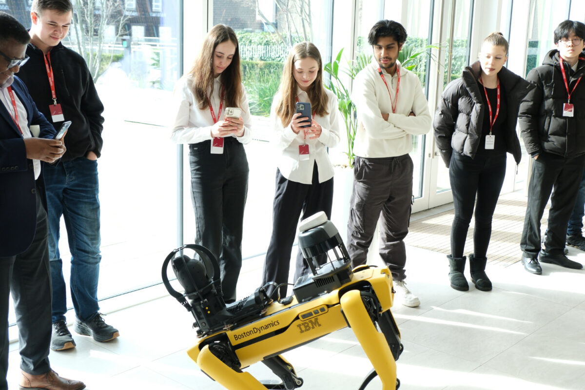 Students looking at a robot Dog