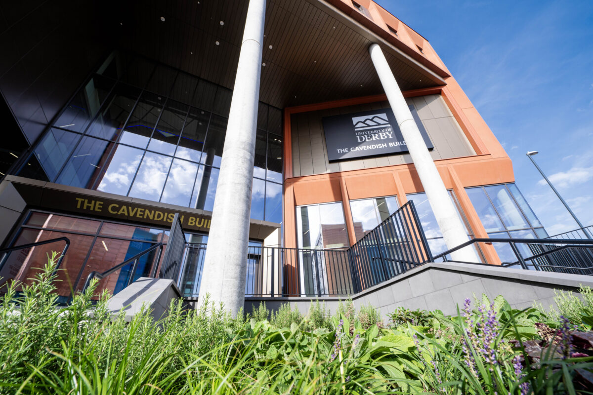 The University of Derby's new Cavendish Building is pictured in the sunshine surrounded by grass and plants