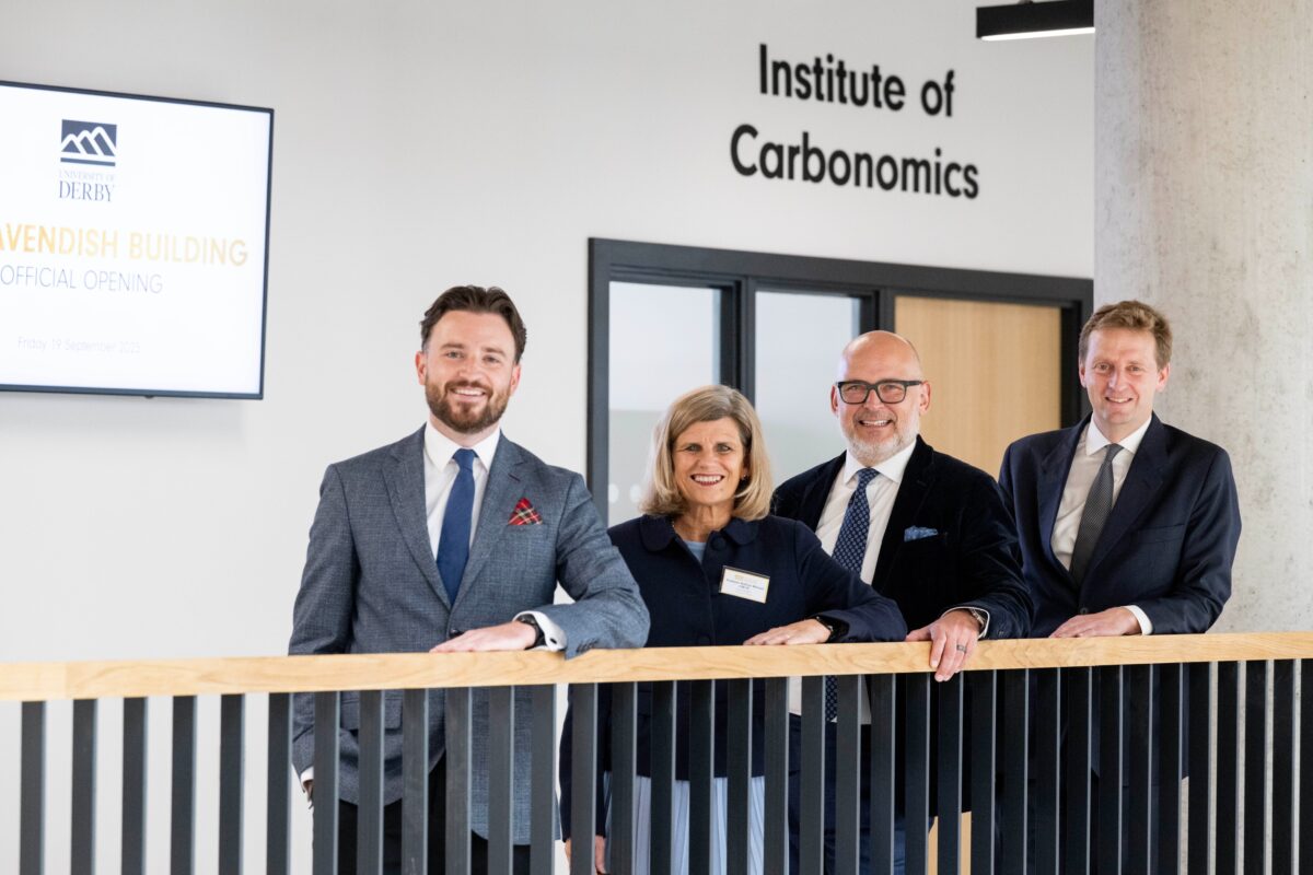 Four people stand in a row at the University of Derby's new Institute of Carbonomics