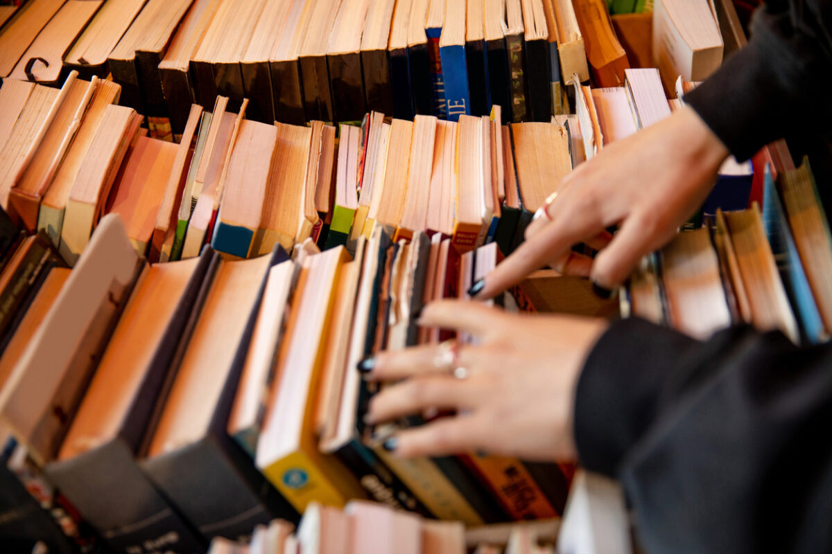 Someone going though books