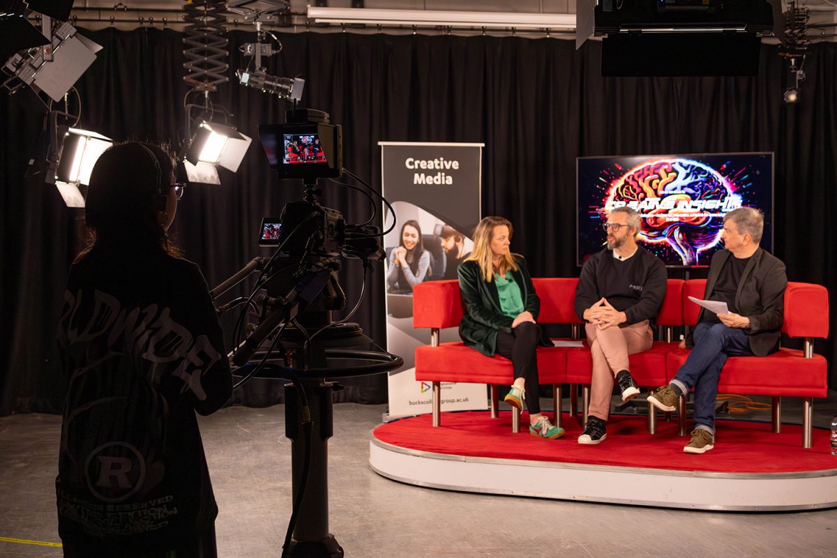 Media Student Filming Guests at Creative Insights Event in TV Studio