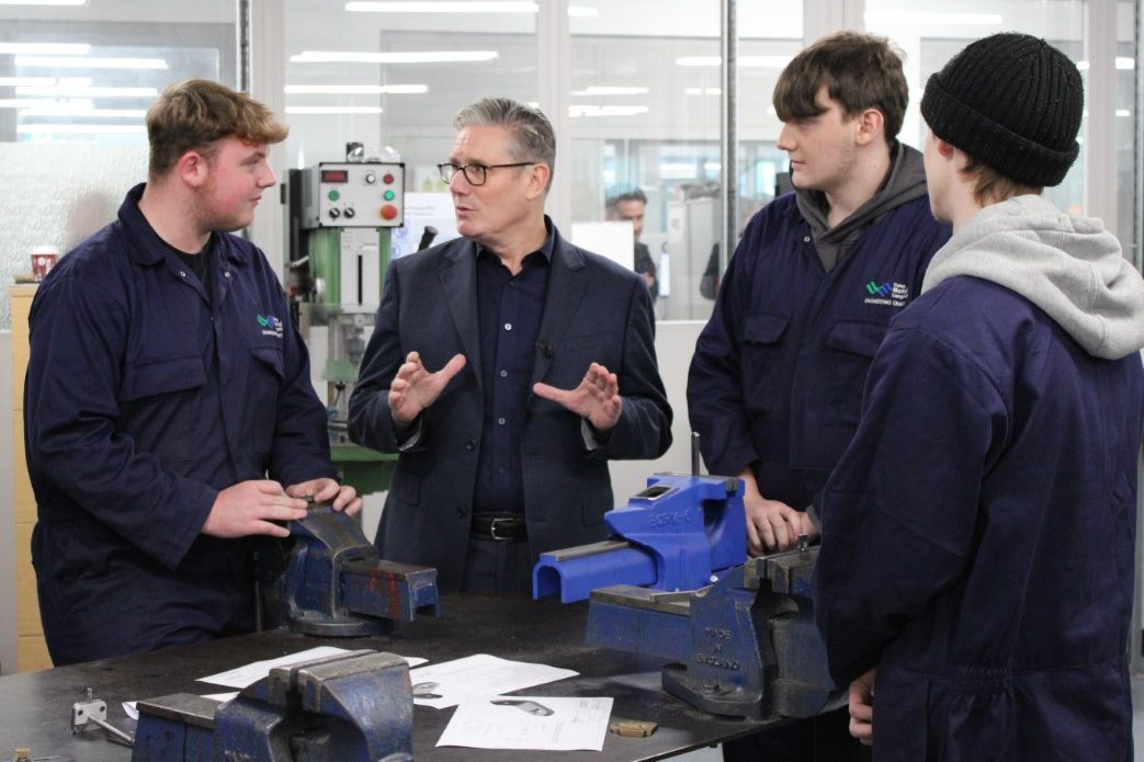 Sir Keir Starmer talking to 3 learners at Coleg Menai in Llangefni