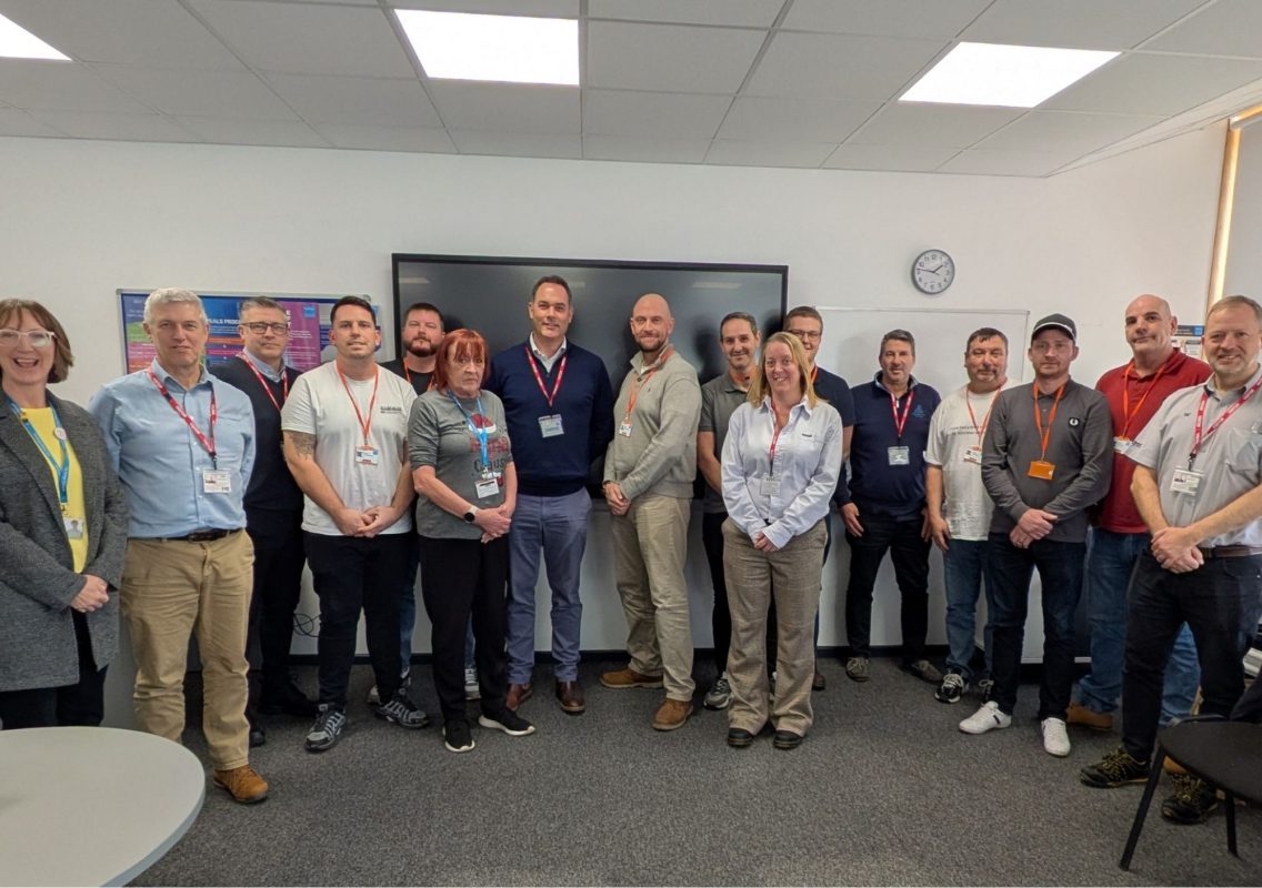 Leadership and Management students pose in a classroom