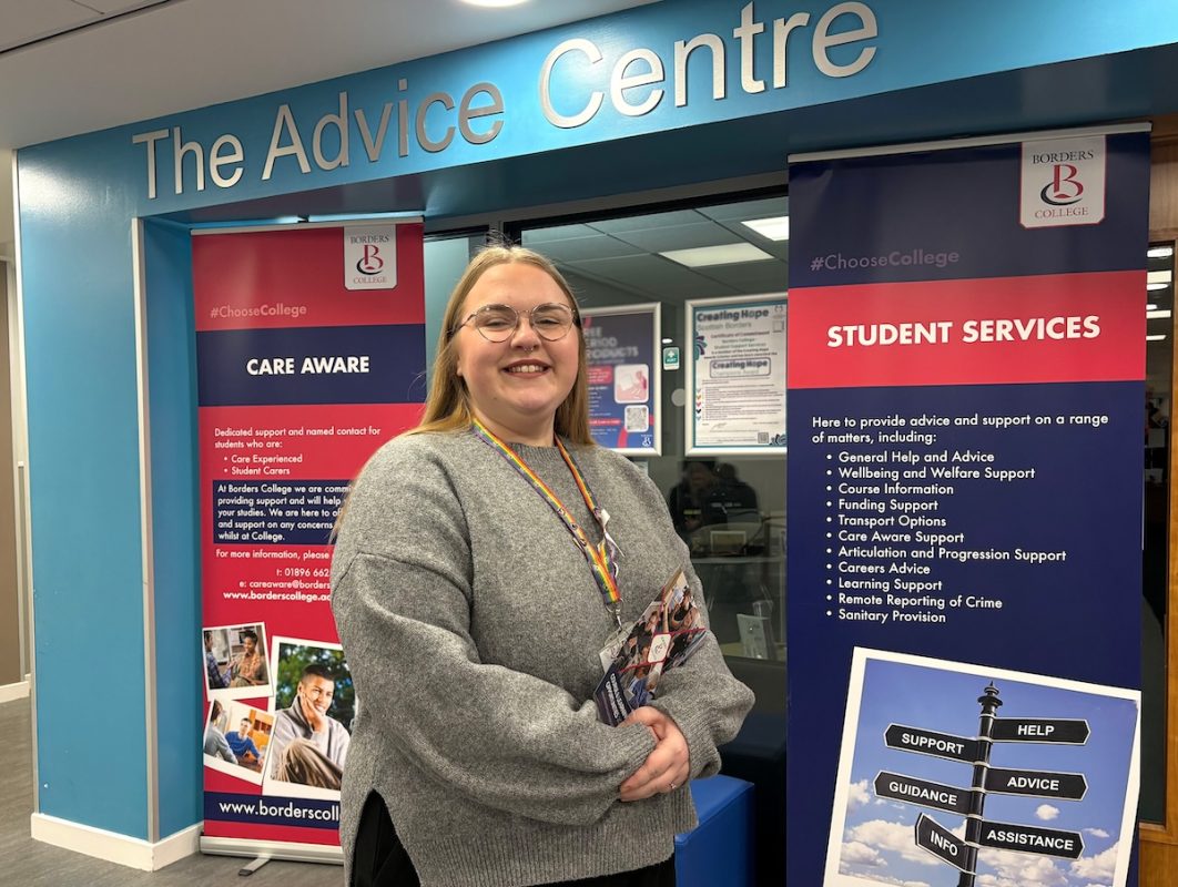 Photo of a person standing outside a Student Advice Centre at the Scottish Borders Campus