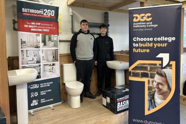 plumbing and bathroom training, two learners in a bathroom classroom setting