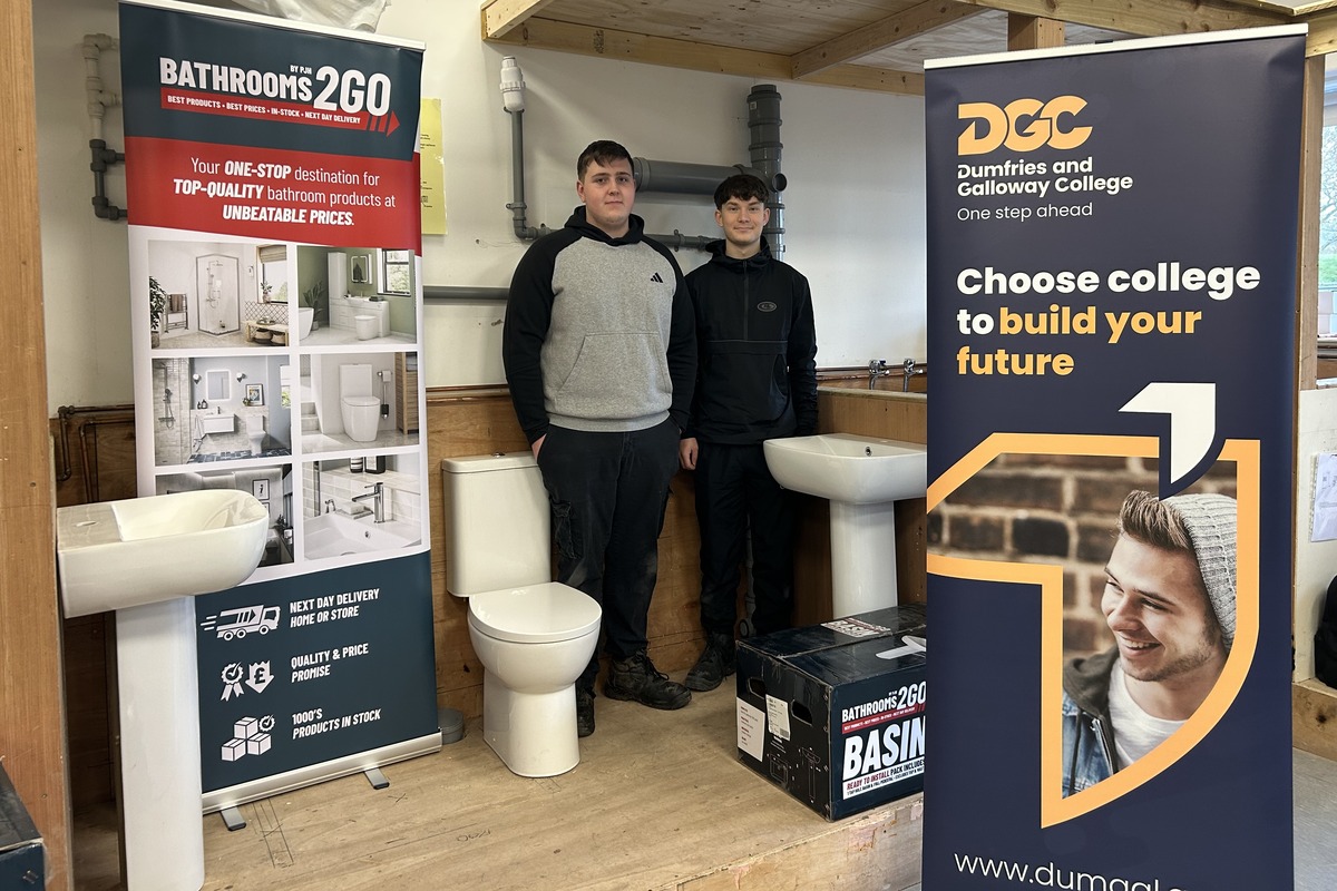 plumbing and bathroom training, two learners in a bathroom classroom setting