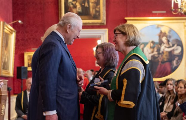 NWSLC Principal and Chief Executive, Marion Plant OBE, FCGI, who is Chair of the MTI Operations Board (right) and MTI Operations Director Lisa Bingley (second from right) are congratulated on the award win by His Majesty The King and Her Majesty The Queen.