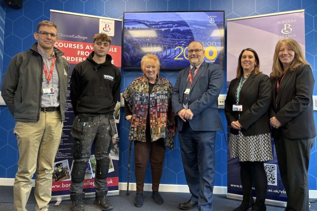 Group photograph of borders college staff and students standing with MSP Christine Grahame