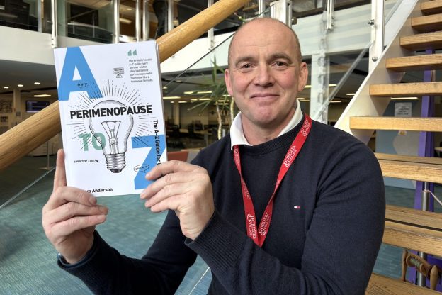 Photo of Sam Anderson holding his new booklet