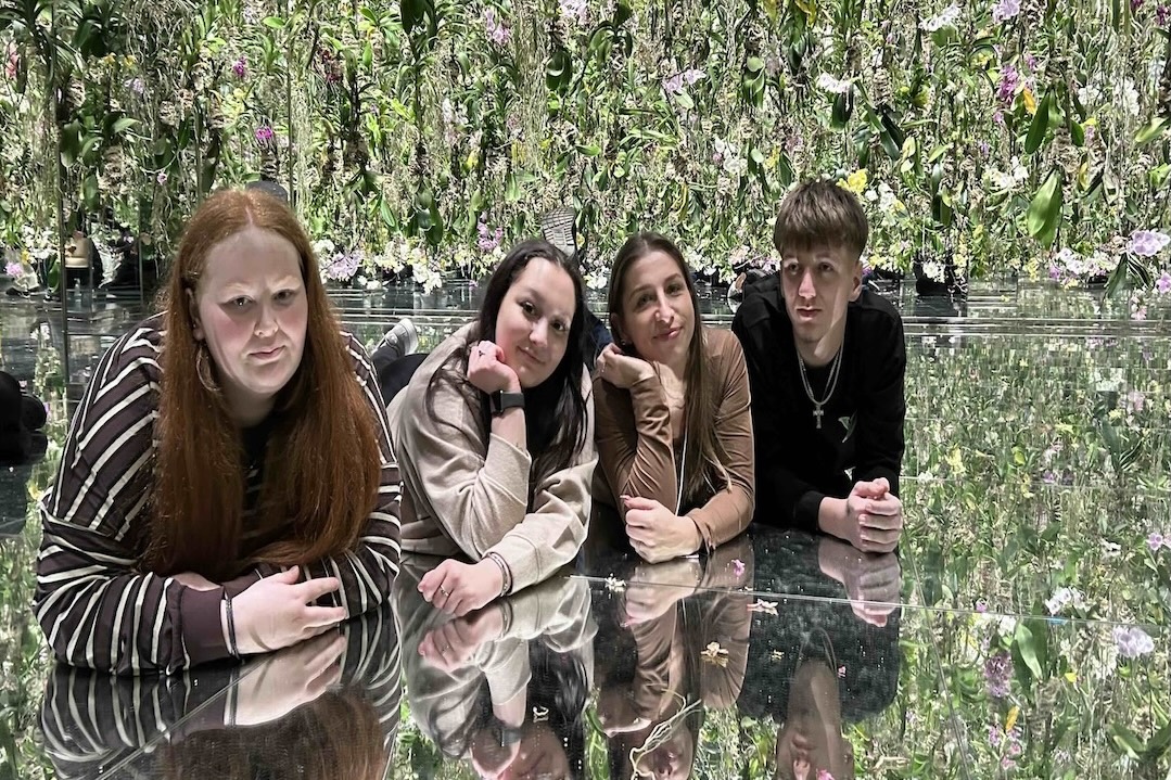 Students relaxing in an orchid filled Zen garden in Japan on the SheffCol Goes Global project.