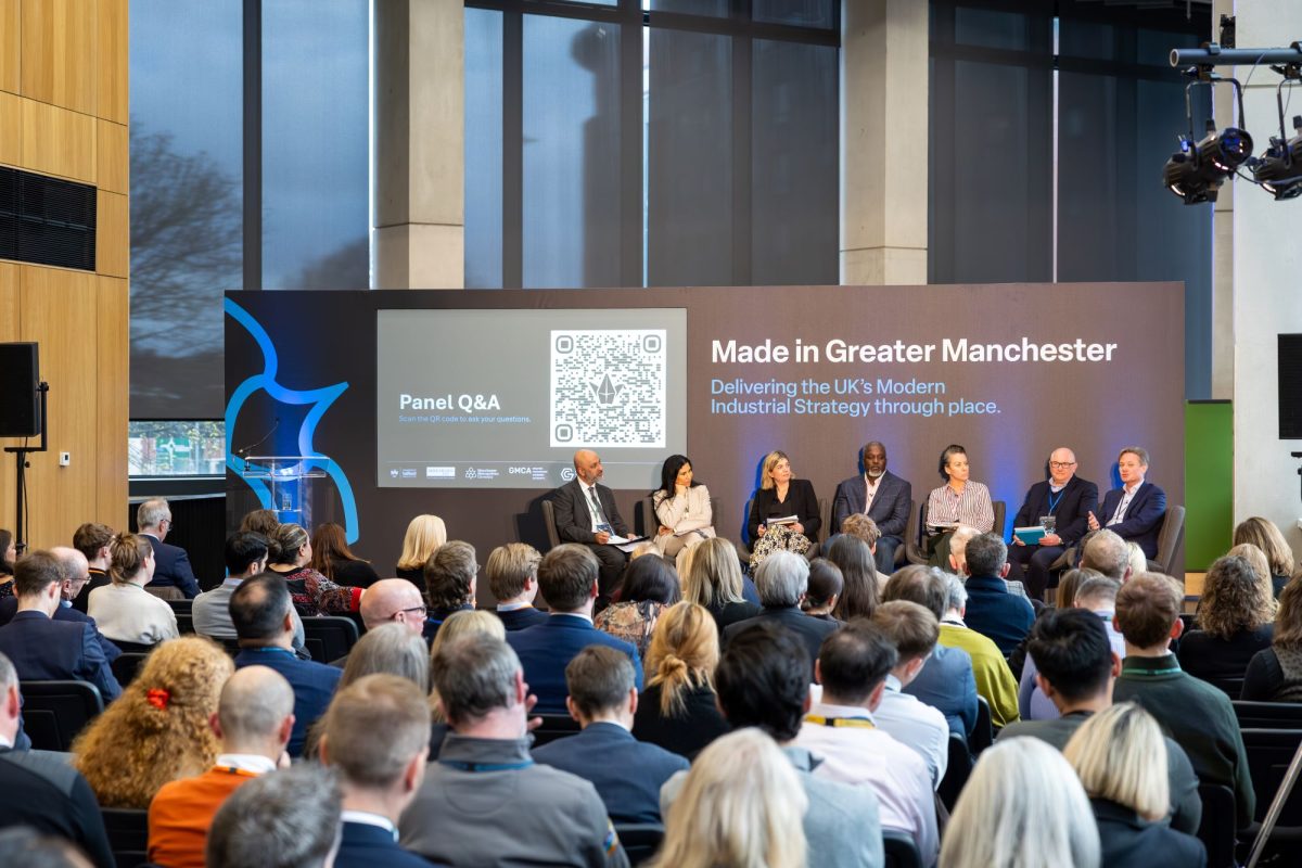 A panel discussion in front of an audience