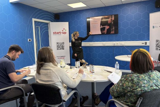 Photo of a student presenting to a judging panel