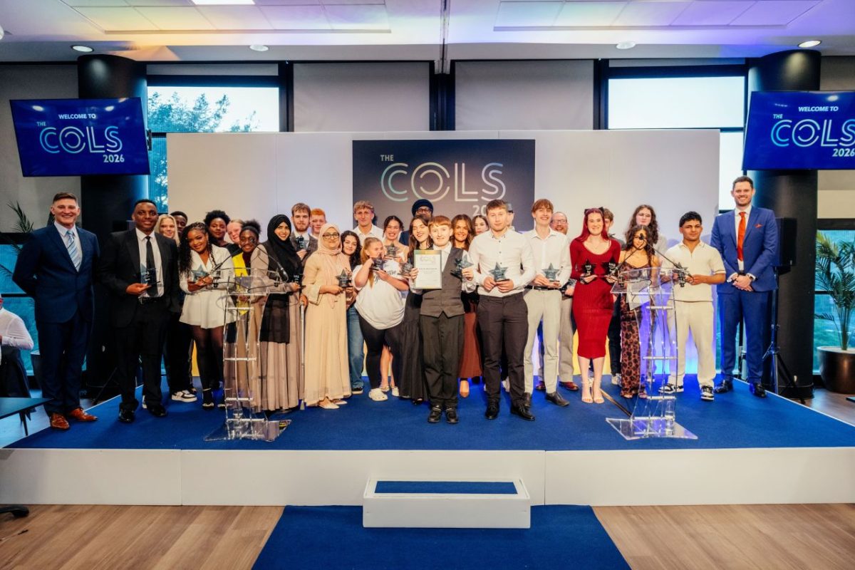 Students and staff pose for picture at awards ceremont