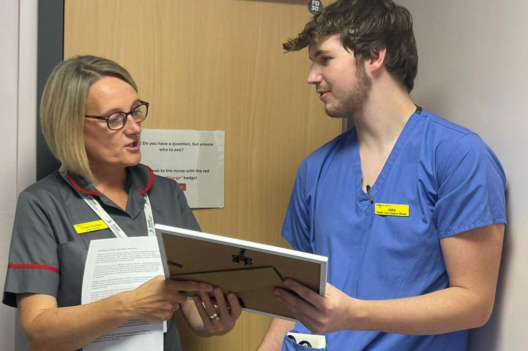Jacob receiving the Chief Nursing Officer Award from his Matron