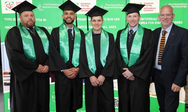 Kepak Merthyr apprenticeship graduates with Cambrian Training Company operations manager Mark Hughes at the graduation ceremony.