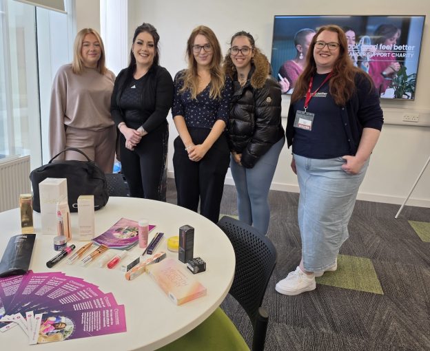 Photo of five people standing in a classroom setting at the Scottish Borders Campus
