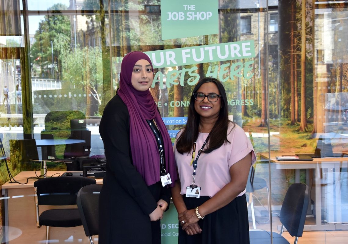 NCFE Aspiration Award winner Gulshan Bi (left) with Bradford College Careers Leader Dina Mistry (right), posing in front of a careers office window.