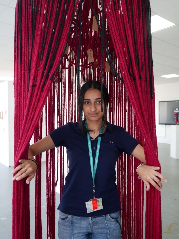 Siman Bansel opening her adult mind part of her installation.