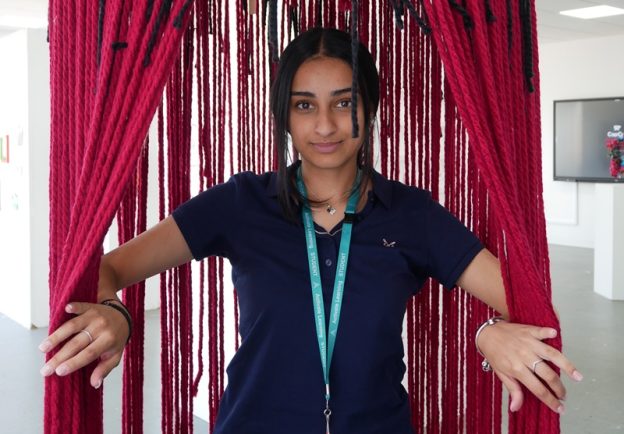 Siman Bansel opening her adult mind part of her installation.