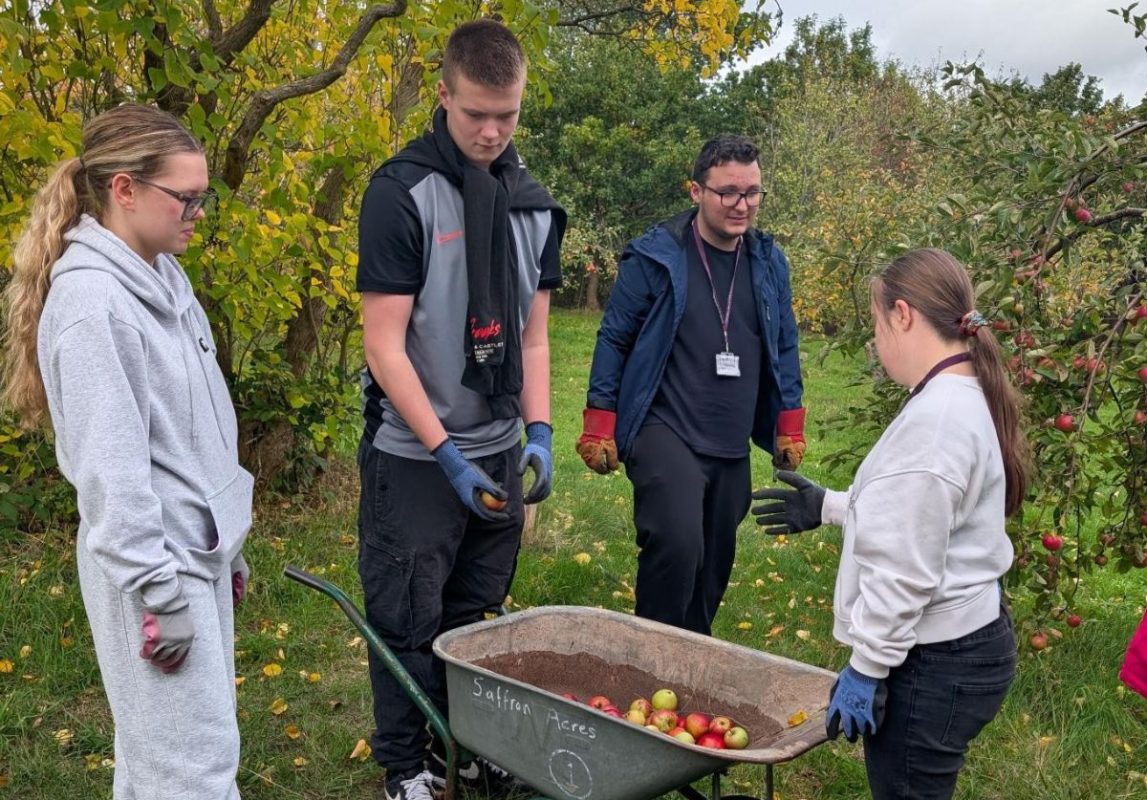 Students volunteering at the Saffron Acres community food growing project