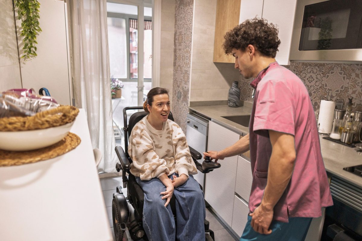 Carer with person in wheelchair