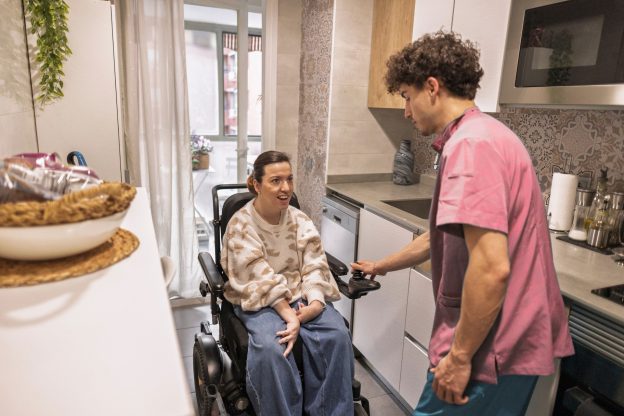 Carer with person in wheelchair