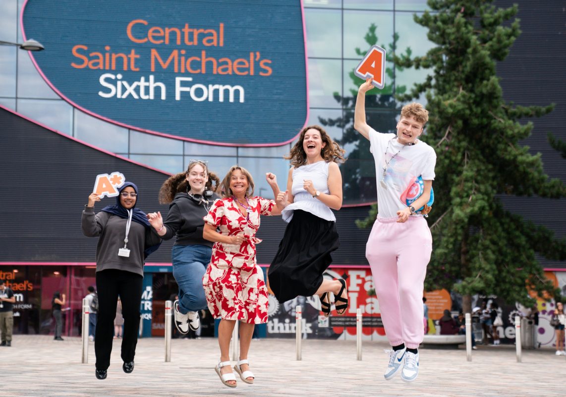 Principal Lisa Capper MBE with MP Sarah Coombes jumping to celebrate results with students