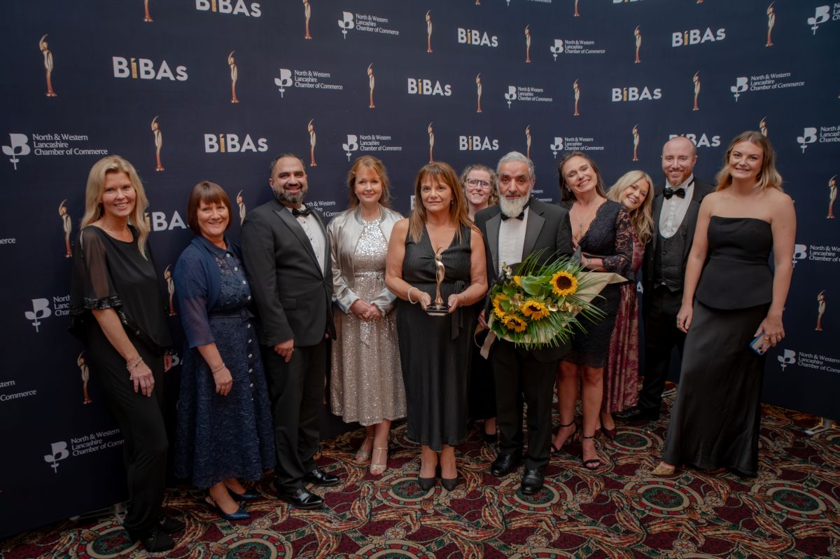 Dr Dad with Blackburn College senior team members celebrating BIBAs success