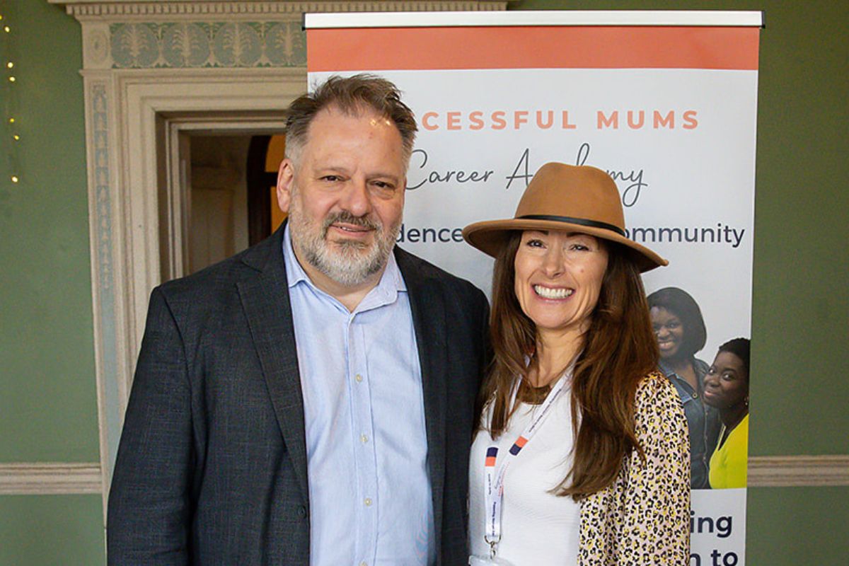 Deputy Mayor Howard Dawber and Successful Mums Founder Jane Knight, stand next to each other in front of a Successful Mums banner. Photo credit: Tessa Clements Photography