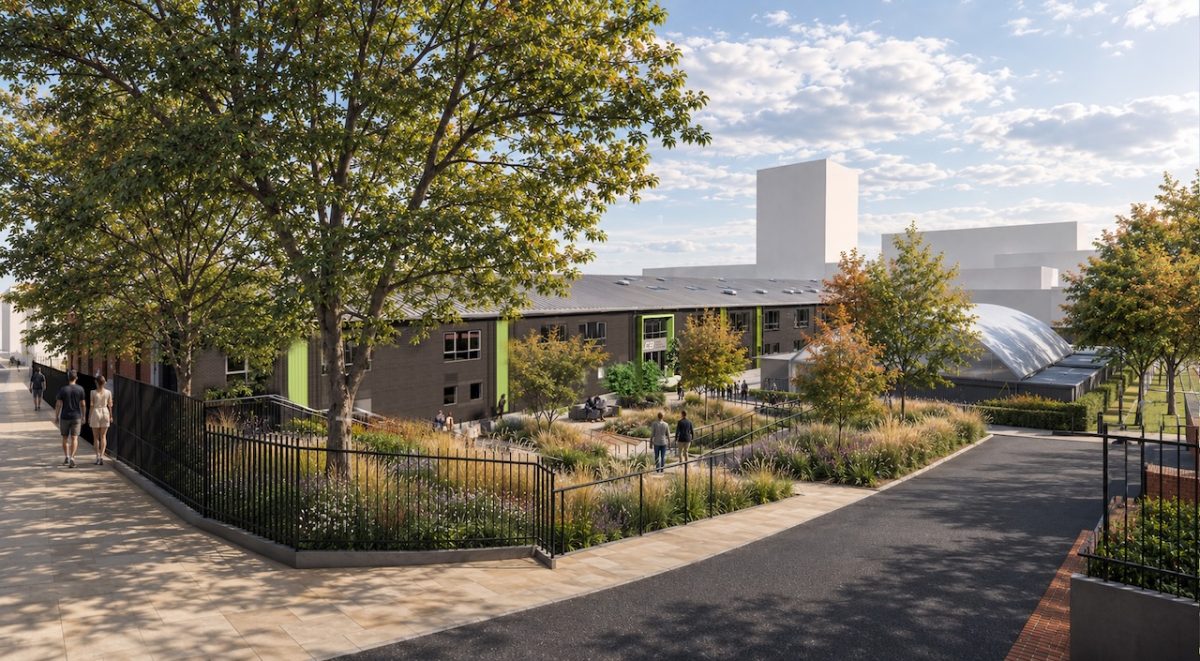 An impression of the planned Leeds College of Building CTEC building from Byron Street showing a large two-storey warehouse building in dark grey with green accents. Trees and people are scattered around the edges.