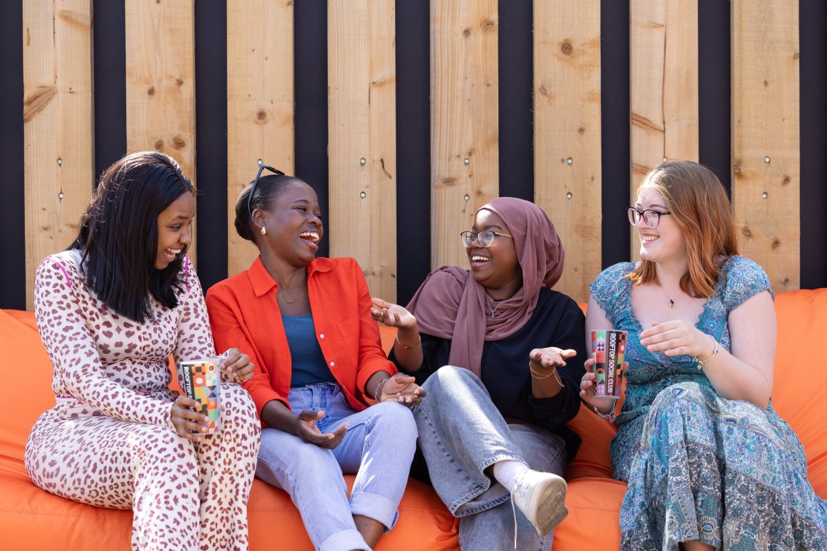 University of Chester students chatting and laughing.