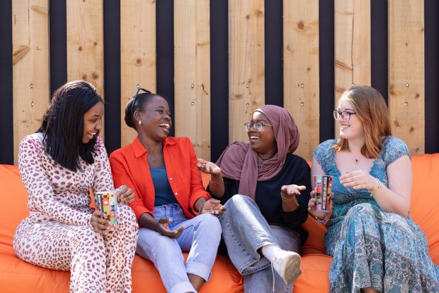 University of Chester students chatting and laughing.