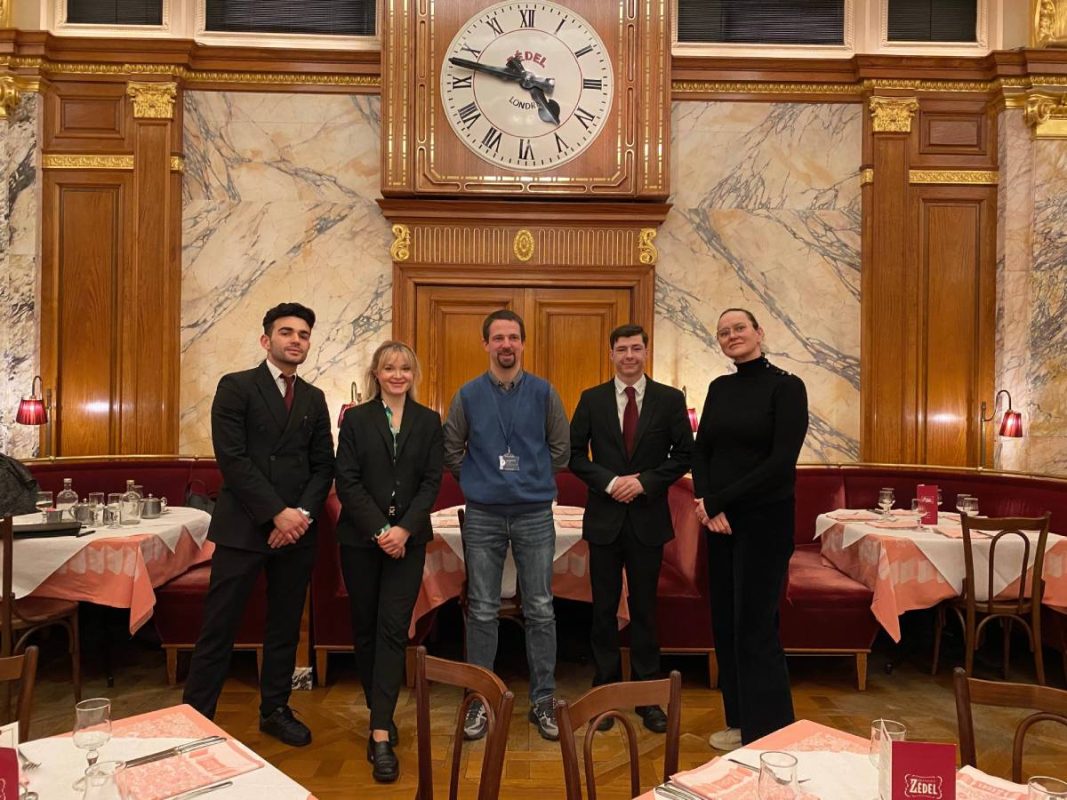 Learnmore workplace coach Seb Sokolowski, centre, with from left Simone Sanna, Alona Urushkina, Luke Vargiu and Teodora Pantiru of Brasserie Zédel